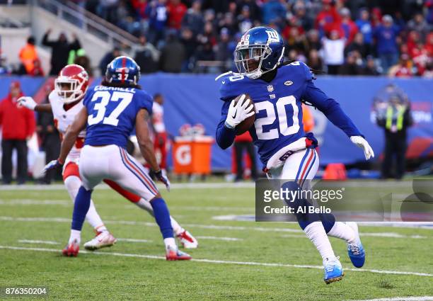 Janoris Jenkins of the New York Giants runs back an interception in the fourth quarter against the Kansas City Chiefs during their game at MetLife...
