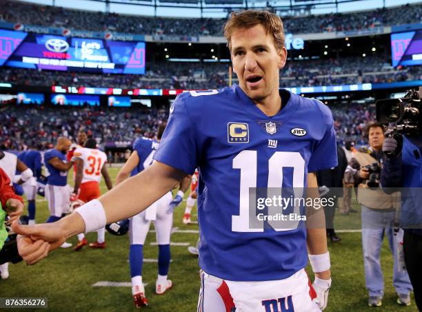 Eli Manning of the New York Giants walks off the field after the 12-9 win over the Kansas City Chiefs in overtime on November 19, 2017 at MetLife...
