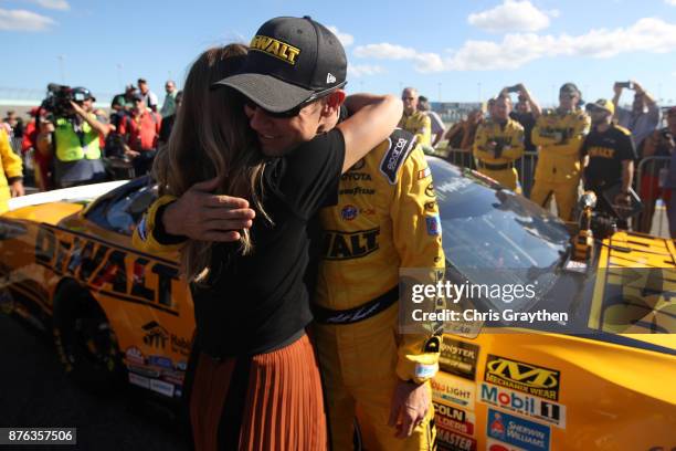 Matt Kenseth, driver of the DeWalt Hurricane Relief Toyota, hugs Amy Earnhardt prior to the Monster Energy NASCAR Cup Series Championship Ford...