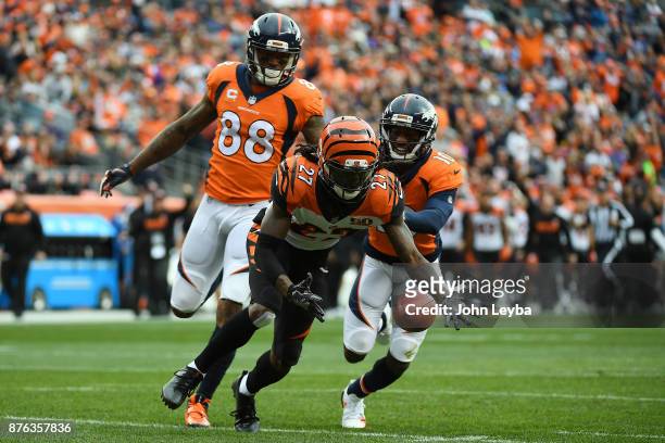 Dre Kirkpatrick of the Cincinnati Bengals recovers a fumble after intercepting it in the first quarter against the Denver Broncos. The Denver Broncos...