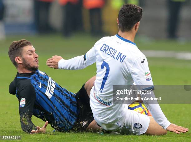Davide Santon of FC Internazionale Milano competes for the ball with Riccardo Orsolini of Atalanta BC during the Serie A match between FC...