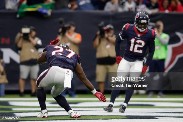 Onta Foreman of the Houston Texans and Bruce Ellington celebrate after a fourth quarter touchdown against the Arizona Cardinals at NRG Stadium on...