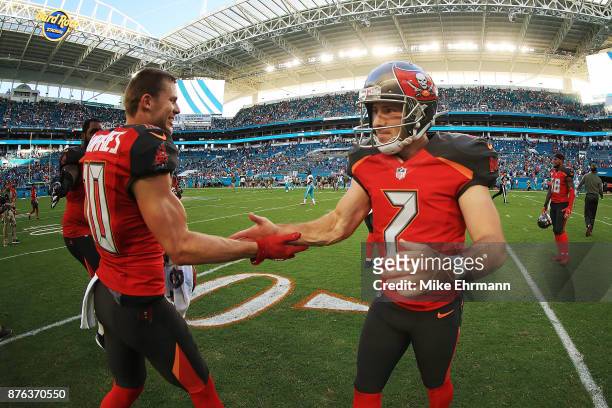 Patrick Murray and Adam Humphries of the Tampa Bay Buccaneers after the win against the Miami Dolphins at Hard Rock Stadium on November 19, 2017 in...