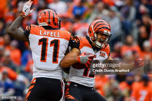 Wide receiver Alex Erickson of the Cincinnati Bengals celebrates with Brandon LaFell after 29 yard second quarter touchdown reception against the...