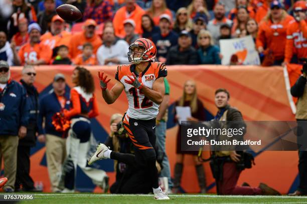 Wide receiver Alex Erickson of the Cincinnati Bengals looks up to catch a pass for a 29 yard second quarter touchdown against the Denver Broncos at...