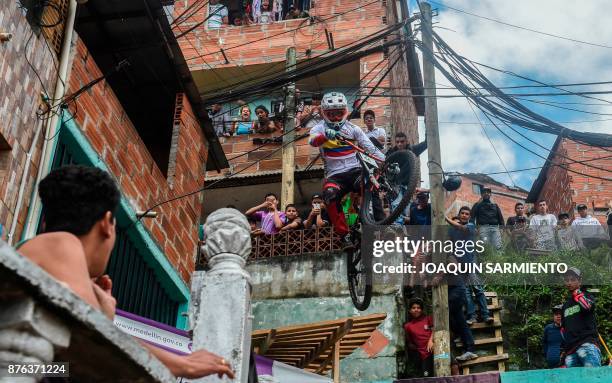 Colombia's downhill rider David Gomez competes during the Urban Bike Inder Medellin race final at the Comuna 1 shantytown in Medellin, Antioquia...