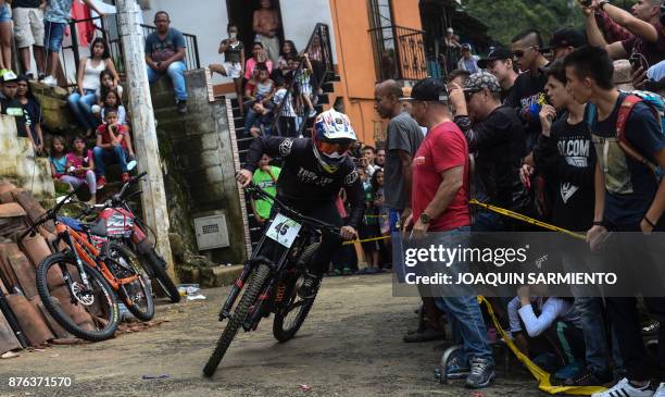 Colombia's downhill rider Mateo Suaza competes during the Urban Bike Inder Medellin race final at the Comuna 1 shantytown in Medellin, Antioquia...