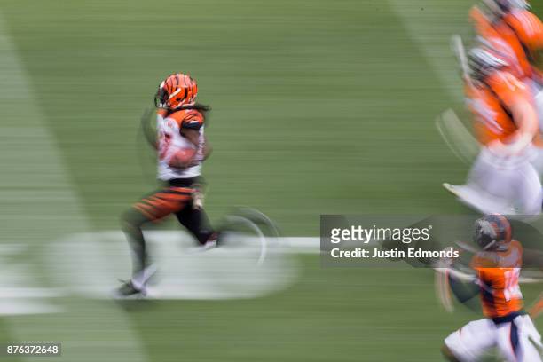 Cornerback Dre Kirkpatrick of the Cincinnati Bengals returns an interception for 87 yards against the Denver Broncos in the first quarter of a game...