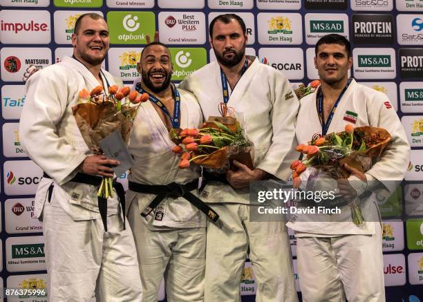 Over 100kg medallists Silver; Maciej Sarnacki of Poland with 2 fingers behind Roy Meyer's head, Gold; Roy Meyer of Netherlands, Bronzes; Soslan...