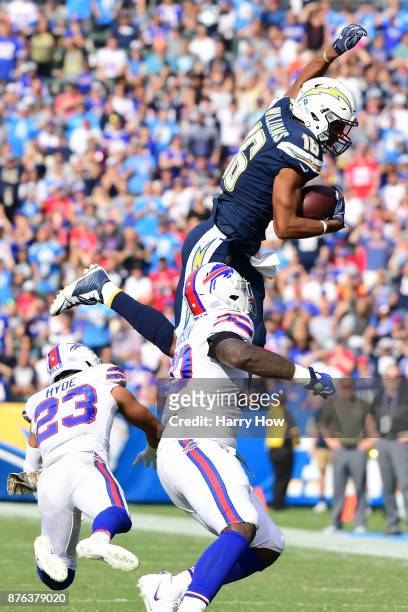 Tyrell Williams of the Los Angeles Chargers leaps over Micah Hyde of the Buffalo Bills during the game at the StubHub Center on November 19, 2017 in...