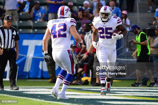 LeSean McCoy of the Buffalo Bills celebrates his touchdown with Patrick DiMarco of the Buffalo Bills in the first quarter making the score 7-7 during...