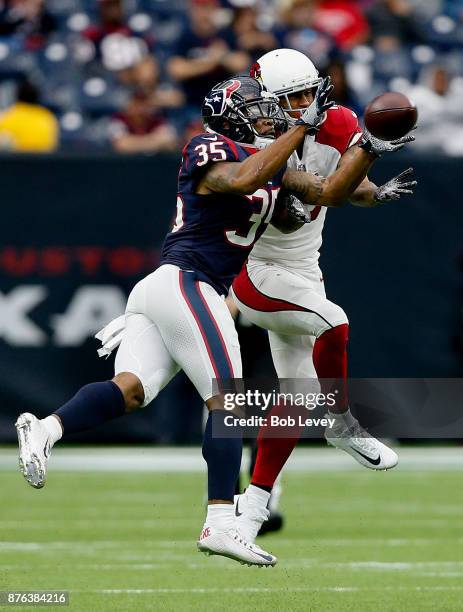 Eddie Pleasant of the Houston Texans intercepts a pass intended for Brittan Golden of the Arizona Cardinals at NRG Stadium on November 19, 2017 in...