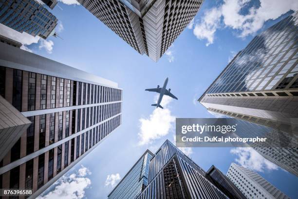 modern architecture in central hong kong - airplane shadow stock pictures, royalty-free photos & images