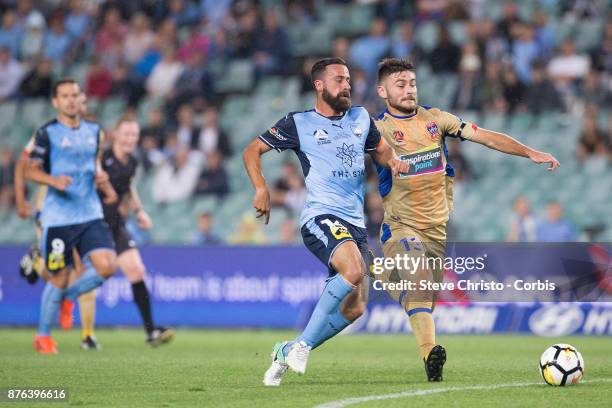 Alex Brosque of the Sydney FC challenges Jets Ivan Vujica and goalkeeper Jack Duncan for the ball during the round seven A-League match between...