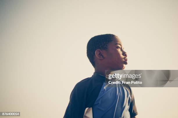 portrait of a confident young african american boy. - 少年　横顔 ストックフォトと画像