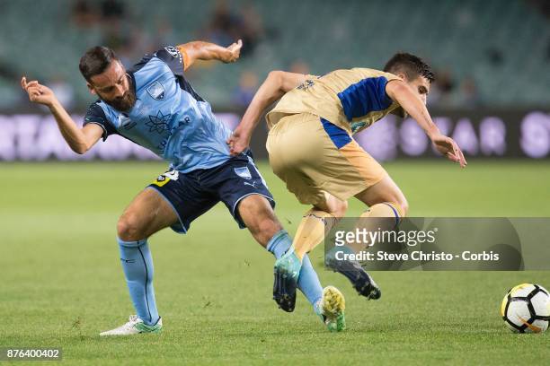 Alex Brosque of the Sydney FC tackles Jets Steven Ugarkovic during the round seven A-League match between Sydney FC and Newcastle Jets at Allianz...
