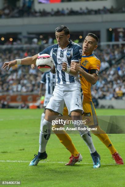 Rogelio Funes Mori of Monterrey fights for the ball with Juninho of Tigres during the 17th round match between Monterrey and Tigres UANL as part of...