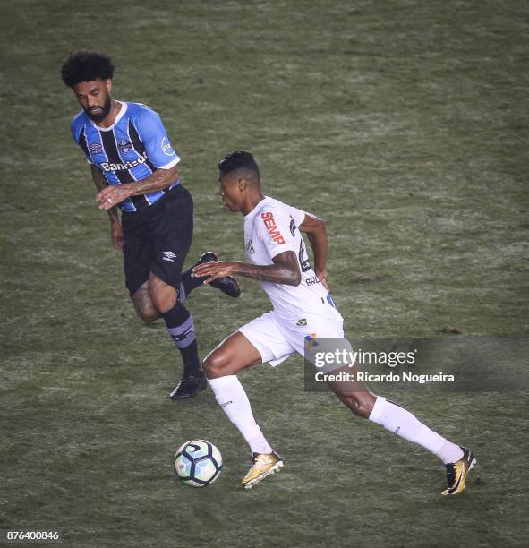 Bruno Henrique of Santos battles for the ball with Cristian of Gremio during the match between Santos and Gremio as a part of Campeonato Brasileiro...