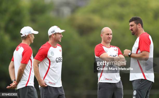 Swans assistant coaches Steve Johnson, Tadhg Kennelly, Brett Kirk and Dean Cox talk during a Sydney Swans AFL pre-season training session at Sydney...