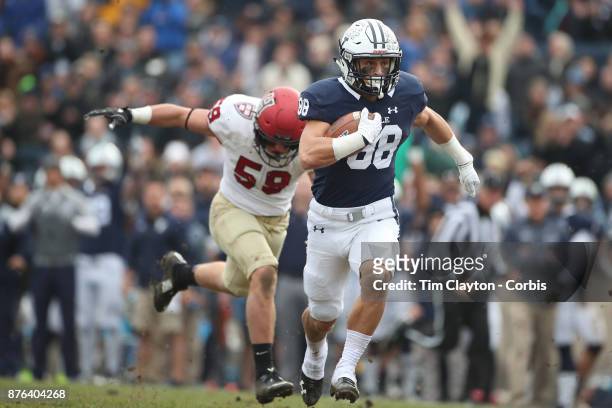 TJP Shohfi of Yale makes a break while challenged by Joey Goodman of Harvard during the Yale V Harvard, Ivy League Football match at the Yale Bowl....