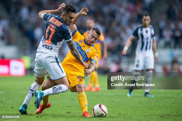 Jesus Eduardo Zavala of Monterrey fights for the ball with Lucas Zelarayan of Tigres during the 17th round match between Monterrey and Tigres UANL as...