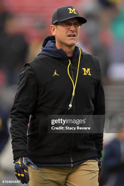 Head coach Jim Harbaugh of the Michigan Wolverines watches action prior to a game against the Wisconsin Badgers at Camp Randall Stadium on November...