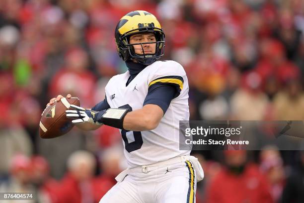 John O'Korn of the Michigan Wolverines drops back to pass during a game against the Wisconsin Badgers at Camp Randall Stadium on November 18, 2017 in...