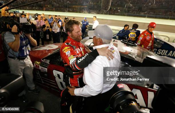 Dale Earnhardt Jr., driver of the AXALTA Chevrolet, celebrates with team owner Rick Hendrick after his final cup series race, the Monster Energy...