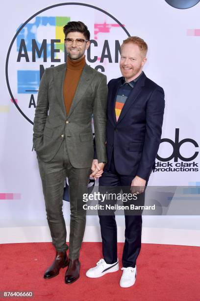 Justin Mikita and Jesse Tyler Ferguson attend the 2017 American Music Awards at Microsoft Theater on November 19, 2017 in Los Angeles, California.