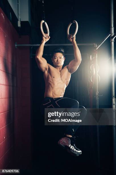 portrait of a bodybuilder - belly ring fotografías e imágenes de stock