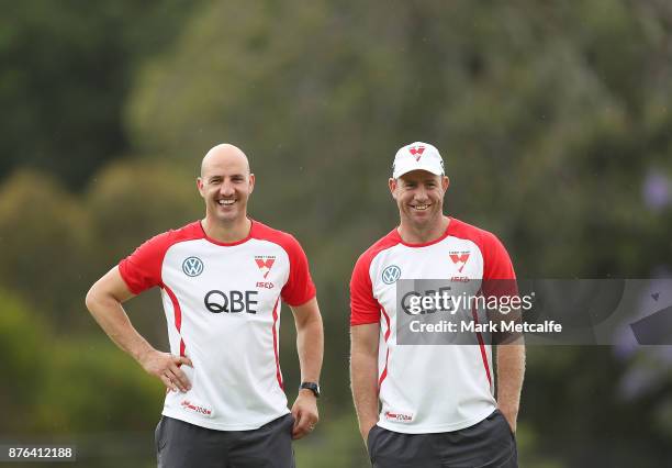 Swans assistant coaches Steve Johnson and Tadhg Kennelly smile during a Sydney Swans AFL pre-season training session at Sydney Grammar on November...