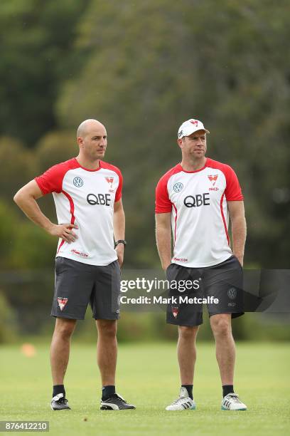 Swans assistant coaches Steve Johnson and Tadhg Kennelly look on during a Sydney Swans AFL pre-season training session at Sydney Grammar on November...