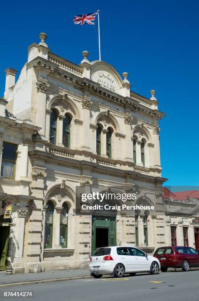 union stores building, with british flag flying above. - flying kiwi stock pictures, royalty-free photos & images