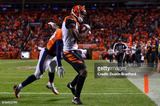 Wide receiver A.J. Green of the Cincinnati Bengals has a fourth quarters touchdown catch under coverage by free safety Bradley Roby of the Denver...