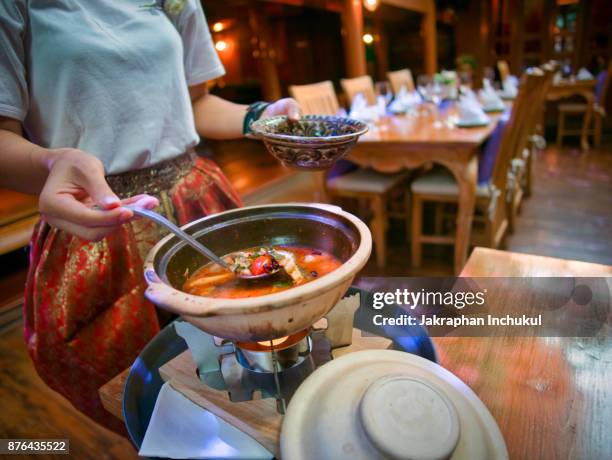 regional food backgrounds - person eating bowl of chili stock pictures, royalty-free photos & images