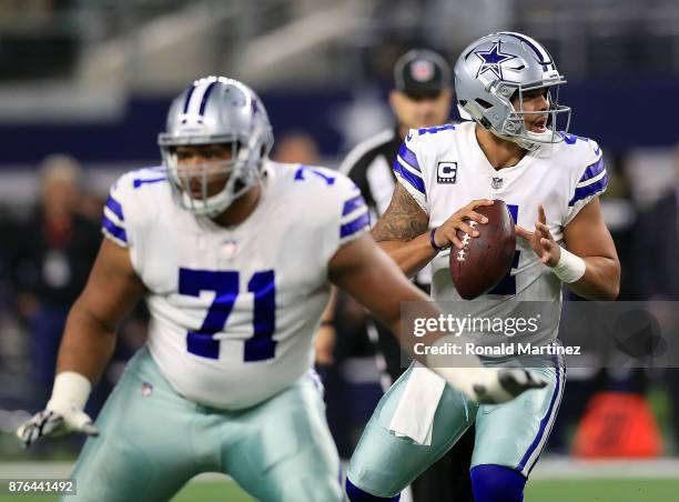 La'el Collins of the Dallas Cowboys protects Dak Prescott of the Dallas Cowboys who looks to pass int he first quarter of a football game against the...