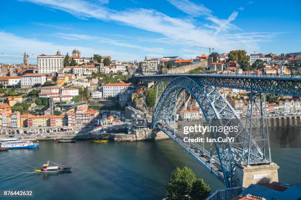 maria pia bridge over the douro river, at porto, portugal. - parto stock pictures, royalty-free photos & images