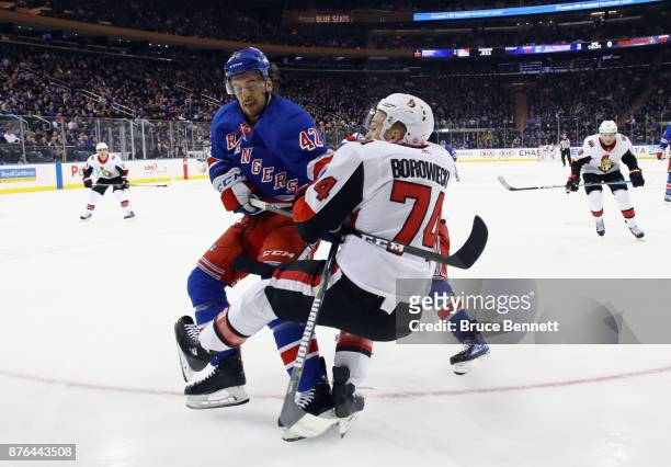 Brendan Smith of the New York Rangers takes a five minute major and a game misconduct for his interference on Mark Borowiecki of the Ottawa Senators...