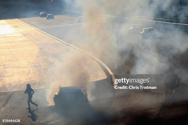 Danica Patrick, driver of the Aspen Dental Ford, runs from her car after being involved in an on-track incident during the Monster Energy NASCAR Cup...