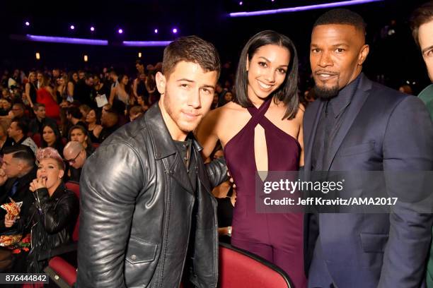 Nick Jonas, Corinne Foxx and Jamie Foxx at the 2017 American Music Awards at Microsoft Theater on November 19, 2017 in Los Angeles, California.