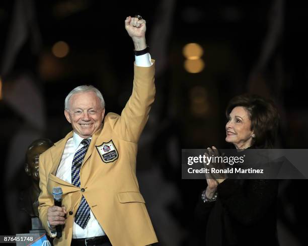 Dallas Cowboys owner Jerry Jones reacts after recieving his ring from the Pro Football Hall of Fame as his wife Gene Jones applauds during the...
