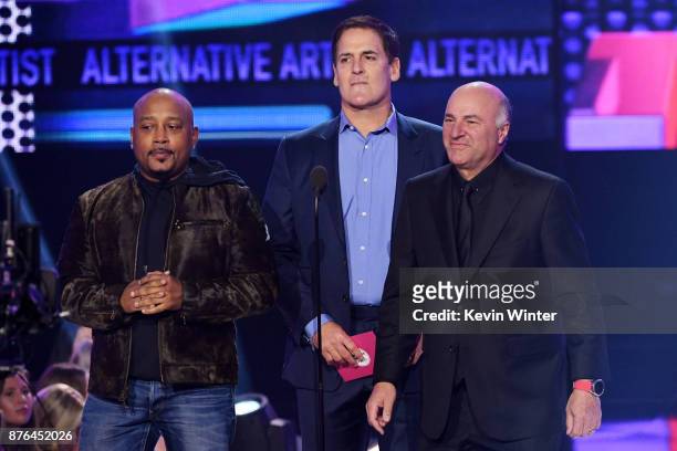Daymond John, Mark Cuban, and Kevin O'Leary speak onstage during the 2017 American Music Awards at Microsoft Theater on November 19, 2017 in Los...