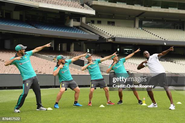 Usain Bolt coaches Australian cricketers Glenn Maxwell, Ashton Agar, Peter Handscomb and Aaron Finch during the Gatorade Fastest Run at the Melbourne...