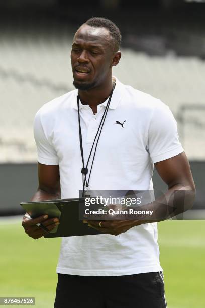 Usain Bolt coaches Australian cricketers Glenn Maxwell, Ashton Agar, Peter Handscomb and Aaron Finch during the Gatorade Fastest Run at the Melbourne...