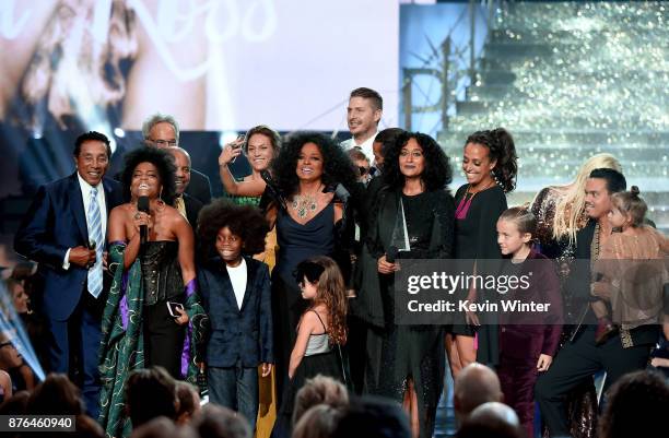 Guests, such as Smokey Robinson , Berry Gordy , host Tracee Ellis Ross and Evan Ross stand onstage as Rhonda Ross Kendrick presents the Lifetime...
