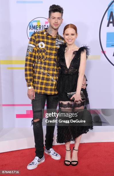 Travis Mills and Madelaine Petsch arrive at the 2017 American Music Awards at Microsoft Theater on November 19, 2017 in Los Angeles, California.