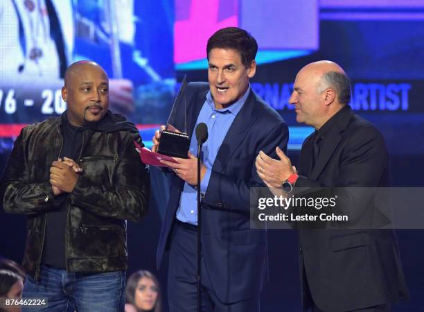 Daymond John, Mark Cuban, and Kevin O'Leary speak onstage during the 2017 American Music Awards at Microsoft Theater on November 19, 2017 in Los...