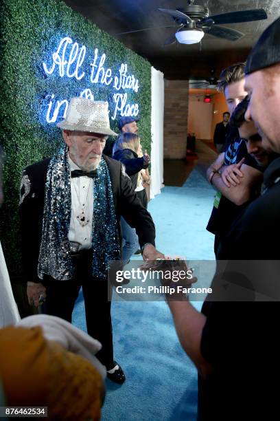 Magician Fantastic Fig entertains festivalgoers in the Vulture Lounge during Vulture Festival LA presented by AT&T at The Hollywood Roosevelt Hotel...