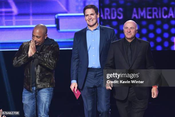 Daymond John, Mark Cuban, and Kevin O'Leary speak onstage during the 2017 American Music Awards at Microsoft Theater on November 19, 2017 in Los...