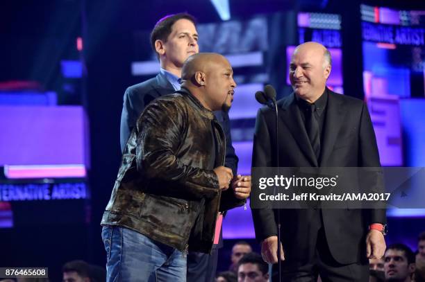 Daymond John, Mark Cuban, and Kevin O'Leary speak onstage during the 2017 American Music Awards at Microsoft Theater on November 19, 2017 in Los...